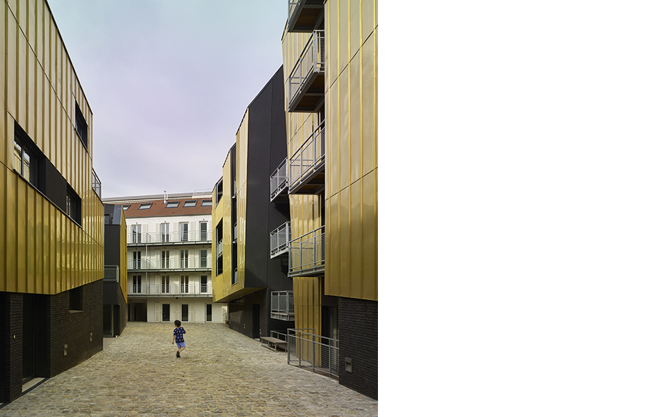 bâtiment faubourien sur restrucuré en lisaison par les balcons des nouvelles constructions